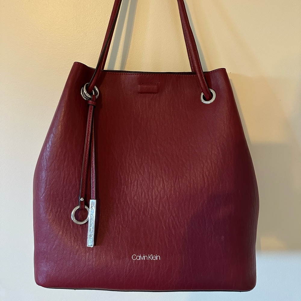 Calvin Klein tote with attachable inner zipper compartment.  Gently used